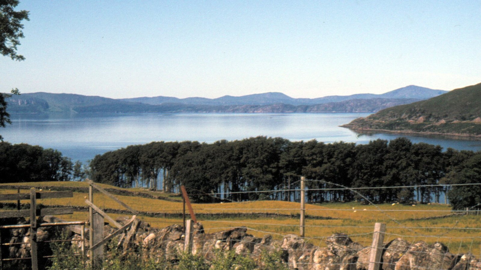 Applecross Bay beneath the Bealach na Bà mountain pass — one of the most famous stops on a private NC500 tour