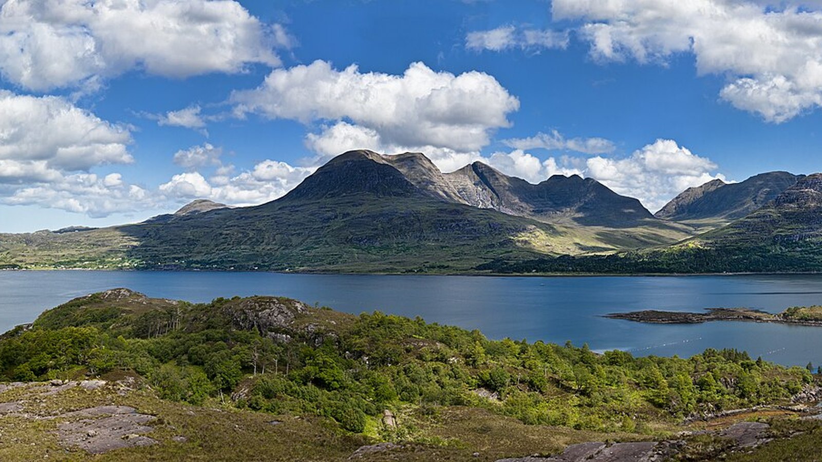 The great sandstone Torridon mountains rising above Loch Torridon — airport transfers from Torridon